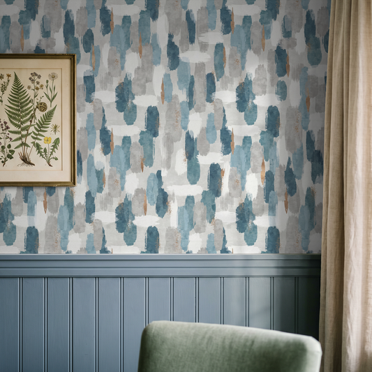 Artisan Azul wallpaper with blue and grey abstract brushstrokes in a cozy room setting.