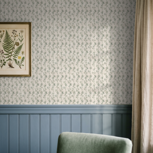 Bamboo Bliss wallpaper with green bamboo leaves on cream background in a living room.