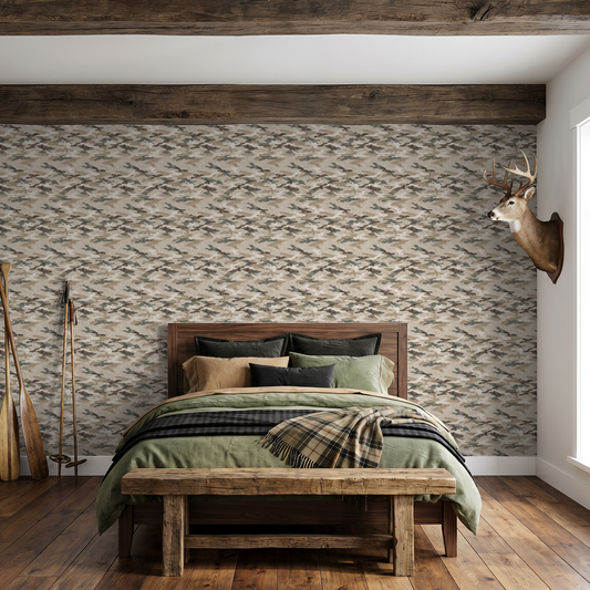 Sahara Shade wallpaper with earthy camouflage pattern in rustic bedroom setting.