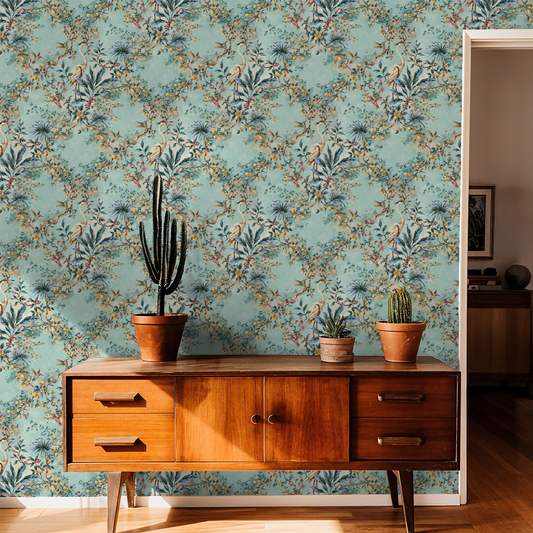 Aqua wallpaper with citrus branches and birds in a vintage living room setting.