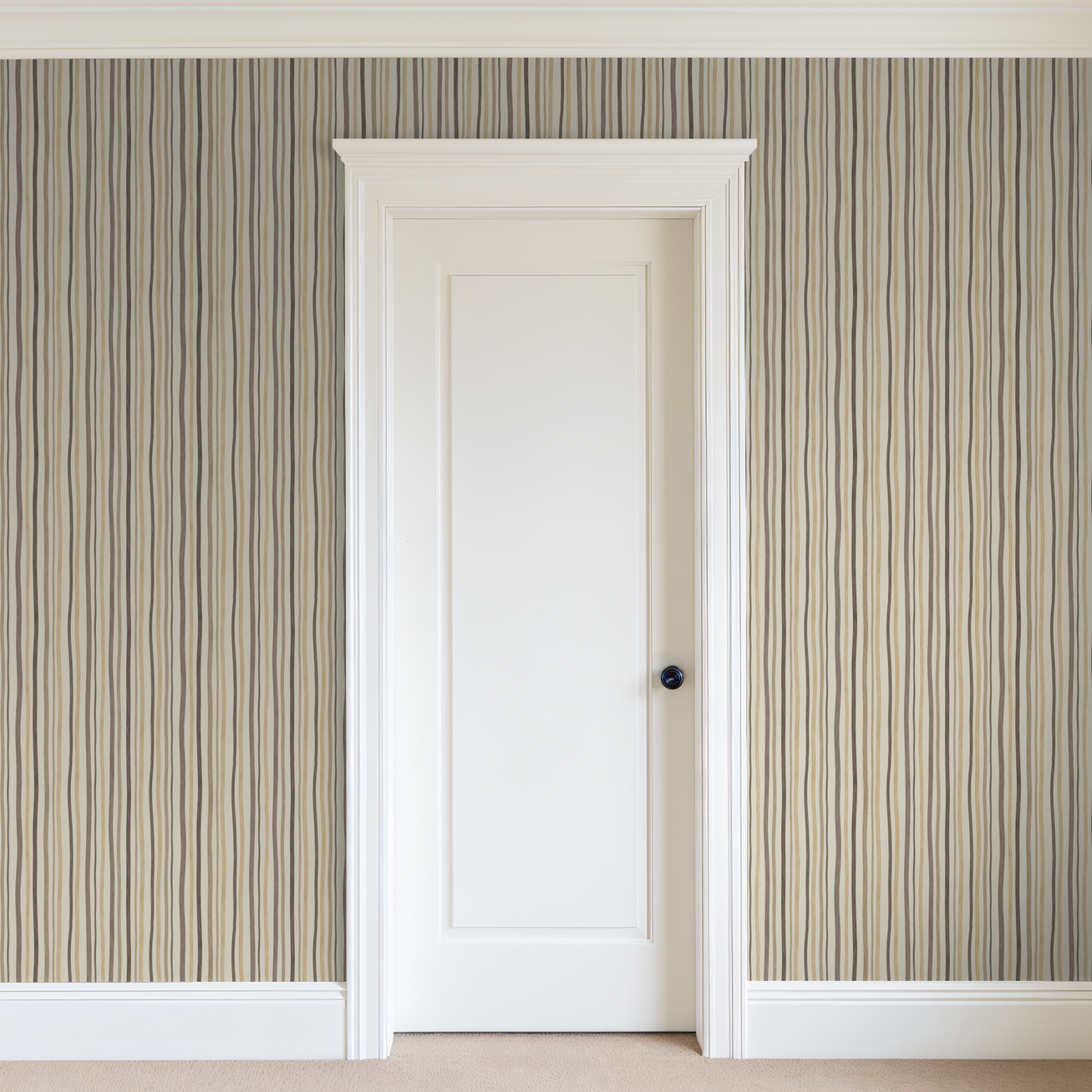 Striped beige and taupe wallpaper with vertical lines in a modern room setting.