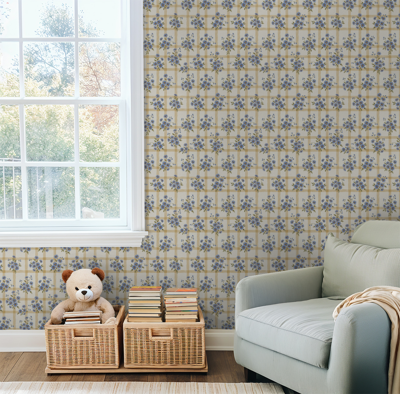 Blue floral and gold grid wallpaper in cozy living room with window and sofa.