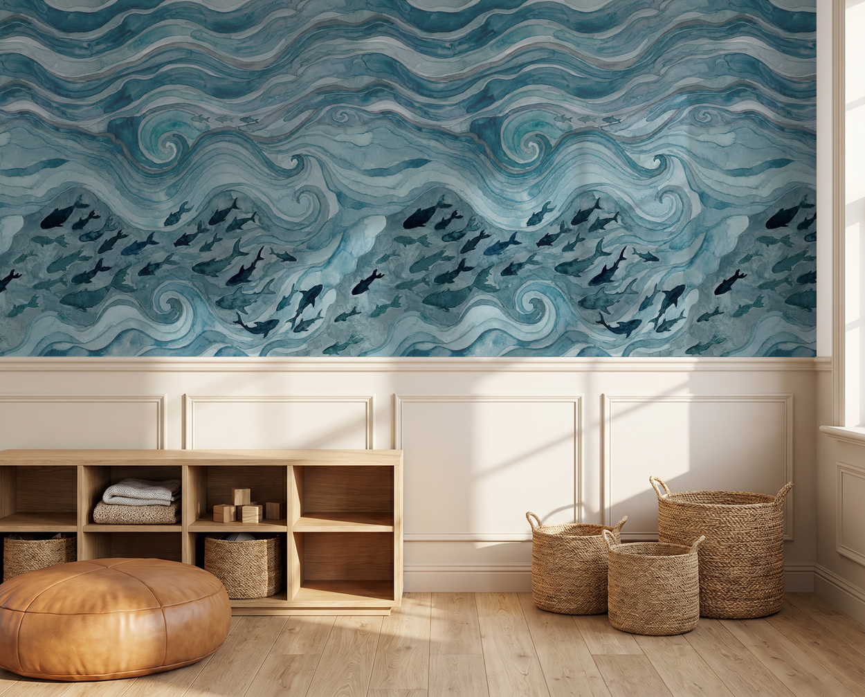 Blue watercolor wave and fish pattern wallpaper in a coastal living room with wicker baskets.