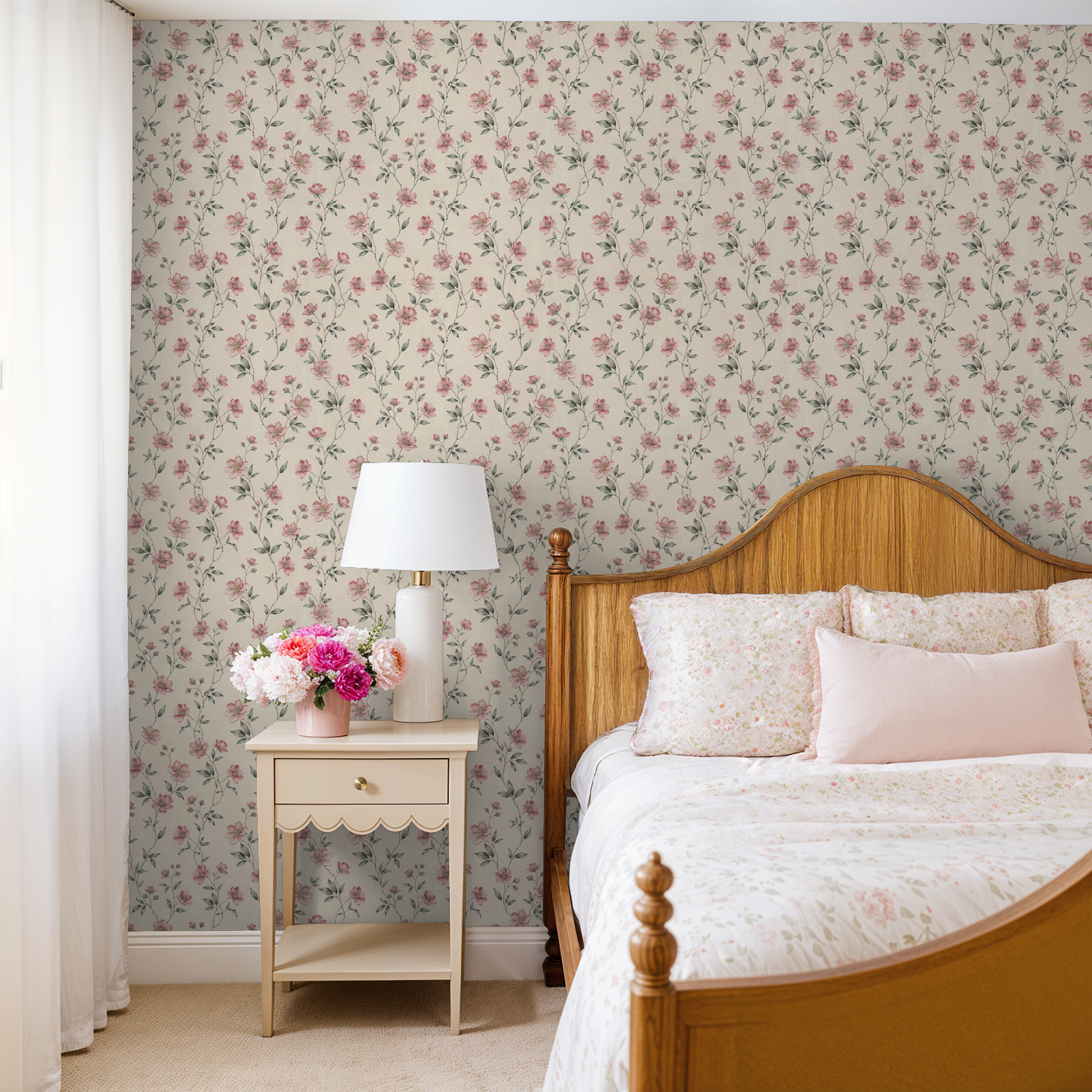 Blush floral wallpaper in cozy bedroom with wooden bed and nightstand.