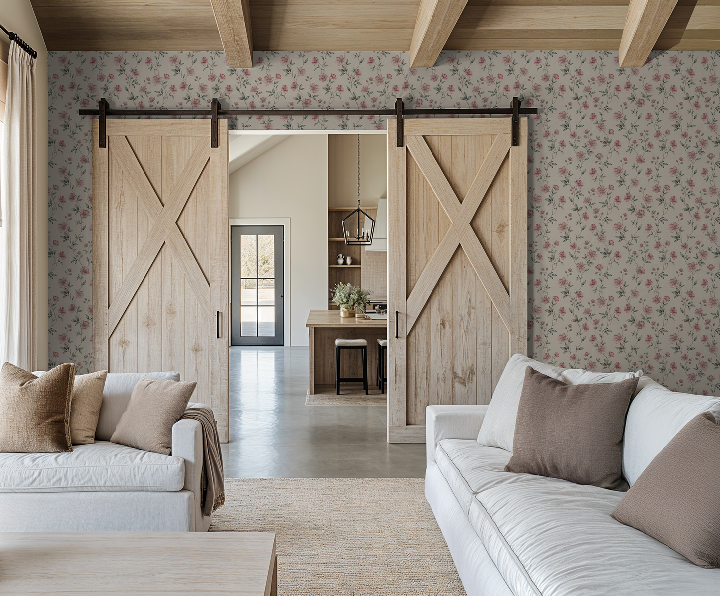 Blush floral wallpaper in cozy living room with barn doors and neutral decor.