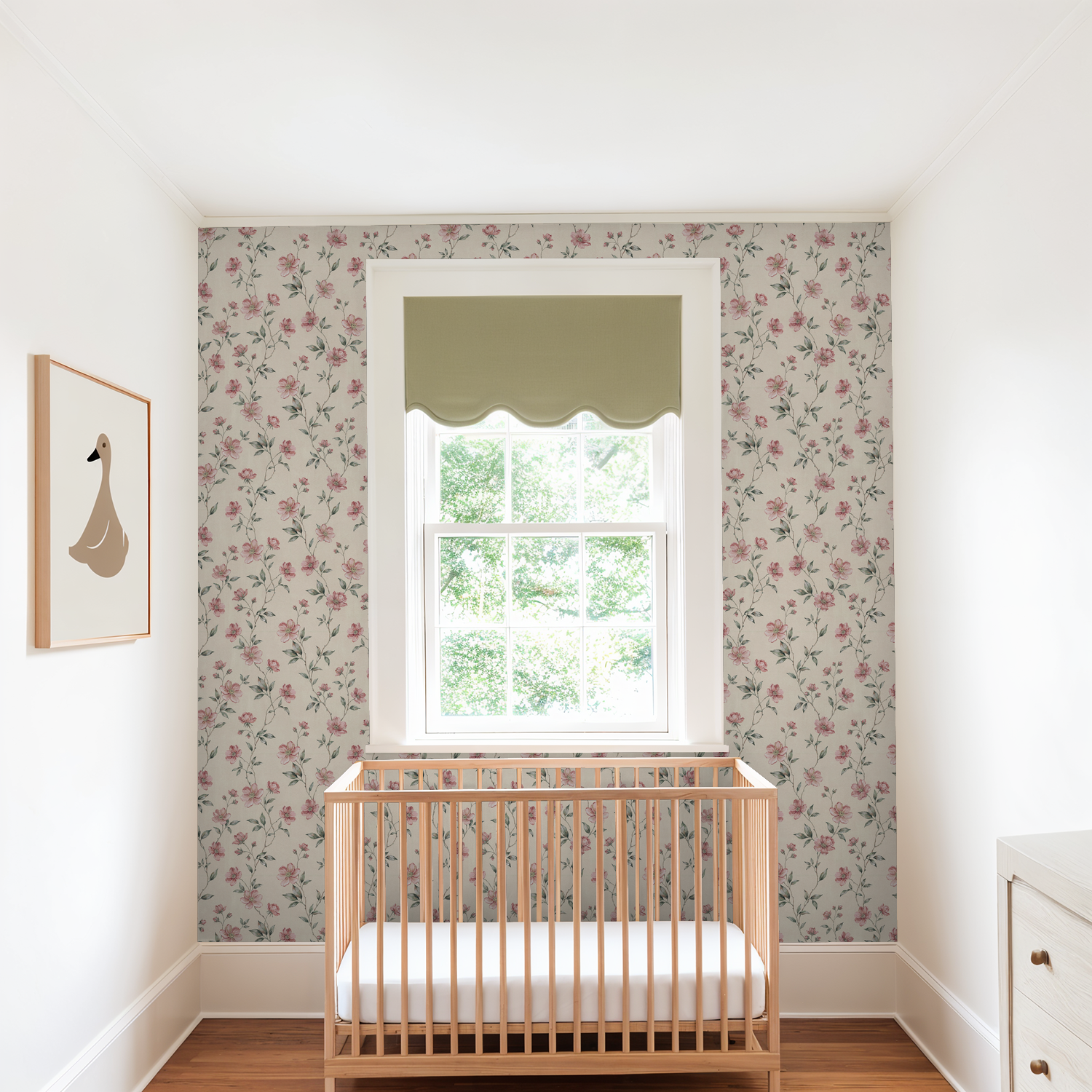 Blush floral wallpaper in nursery with wooden crib and window.