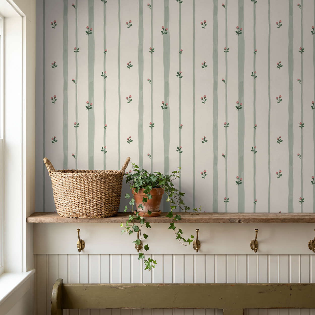 Bordeaux Bloom wallpaper with sage stripes and pink buds in rustic room setting.