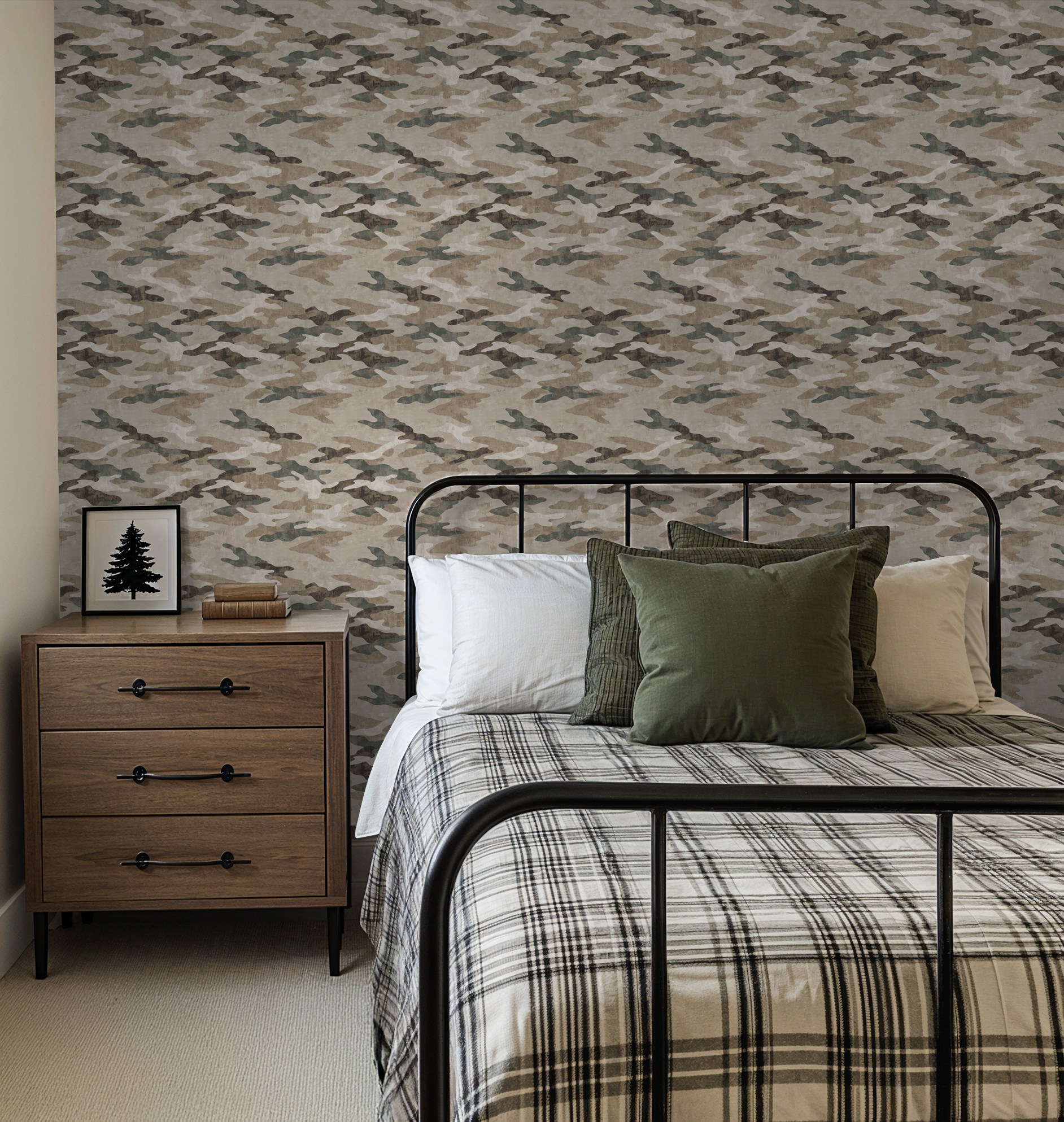 Camouflage wallpaper in earthy tones in a modern bedroom with plaid bedding.