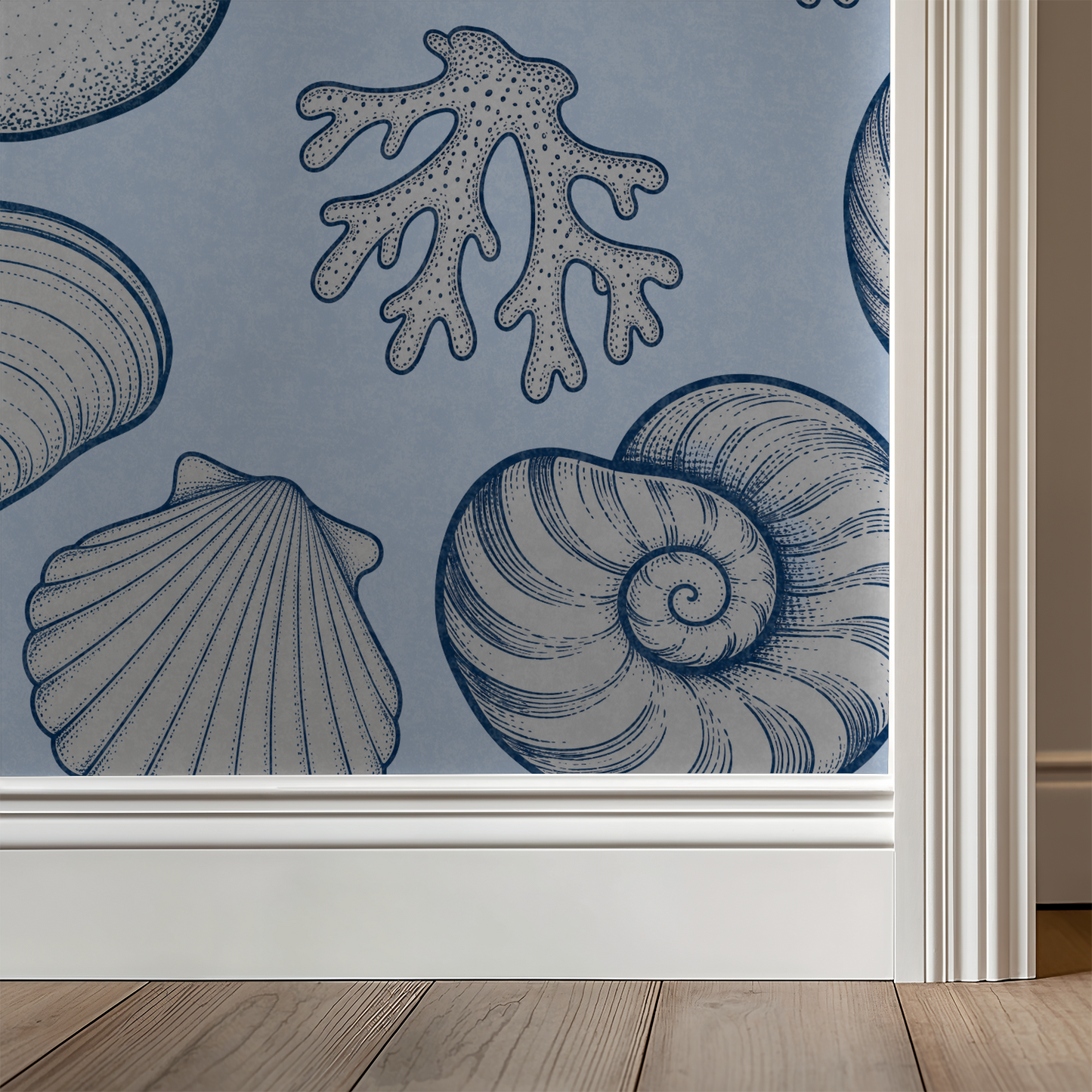 Coastal seashell and coral pattern on blue wallpaper in room setting.
