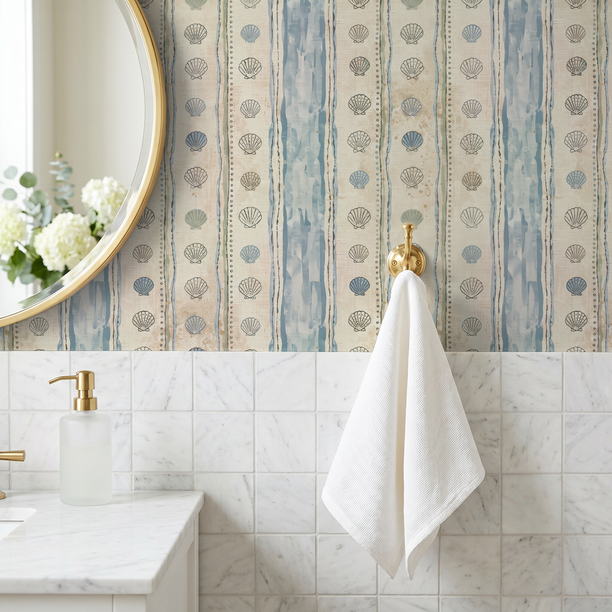 Coastal seashell and stripe wallpaper in a bathroom with gold accents.