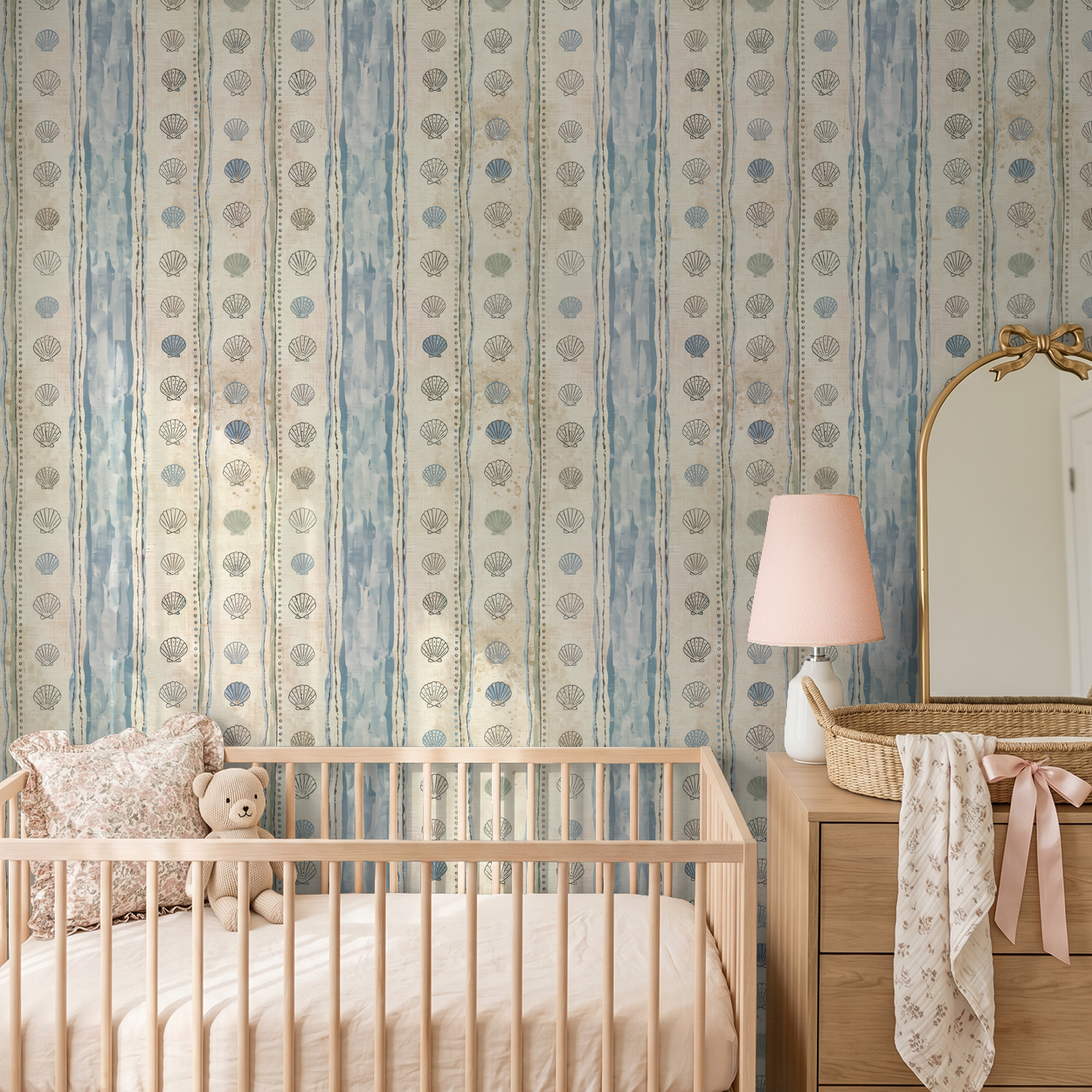 Coastal seashell stripe wallpaper in calming nursery setting.