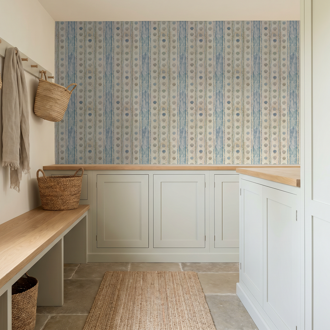 Coastal seashell striped wallpaper in serene blue tones in a rustic room setting.