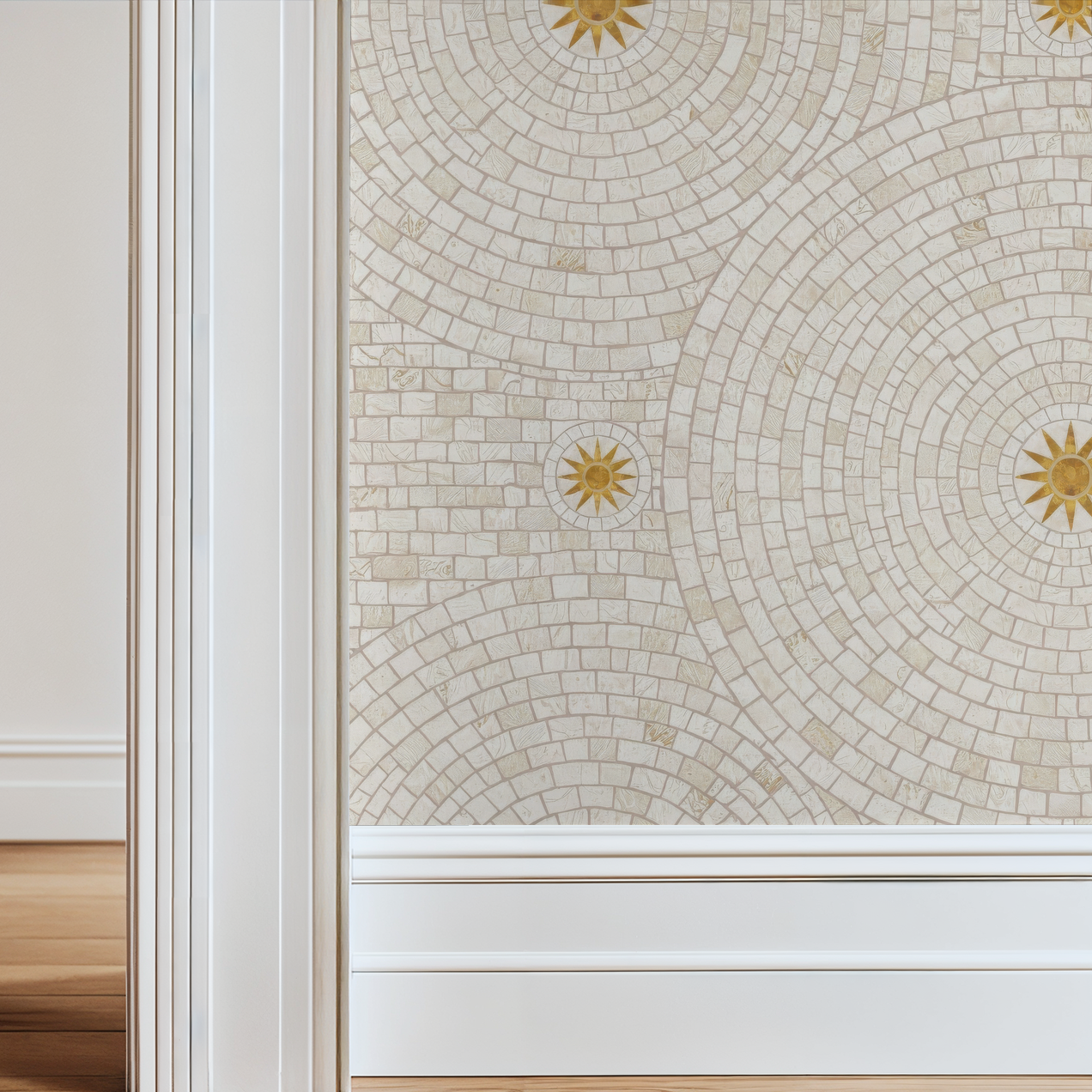 Cream and gold geometric mosaic wallpaper in a bright room with white trim