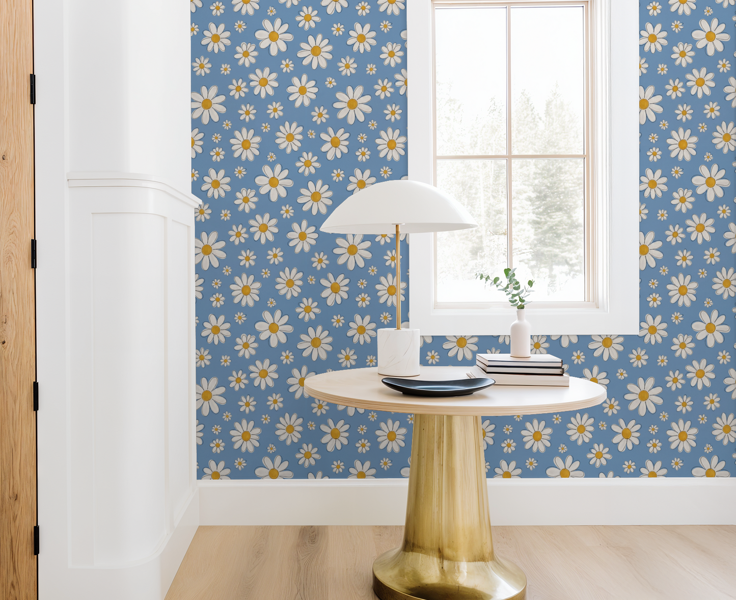 Daisy Delight wallpaper with white daisies on blue in modern room with table and lamp.