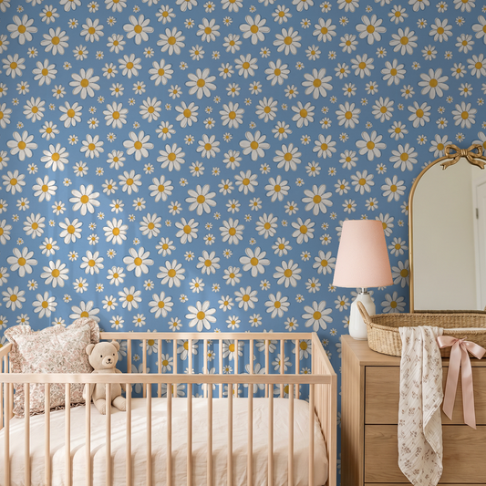 Daisy Delight wallpaper with white daisies on blue in a cozy nursery setting.