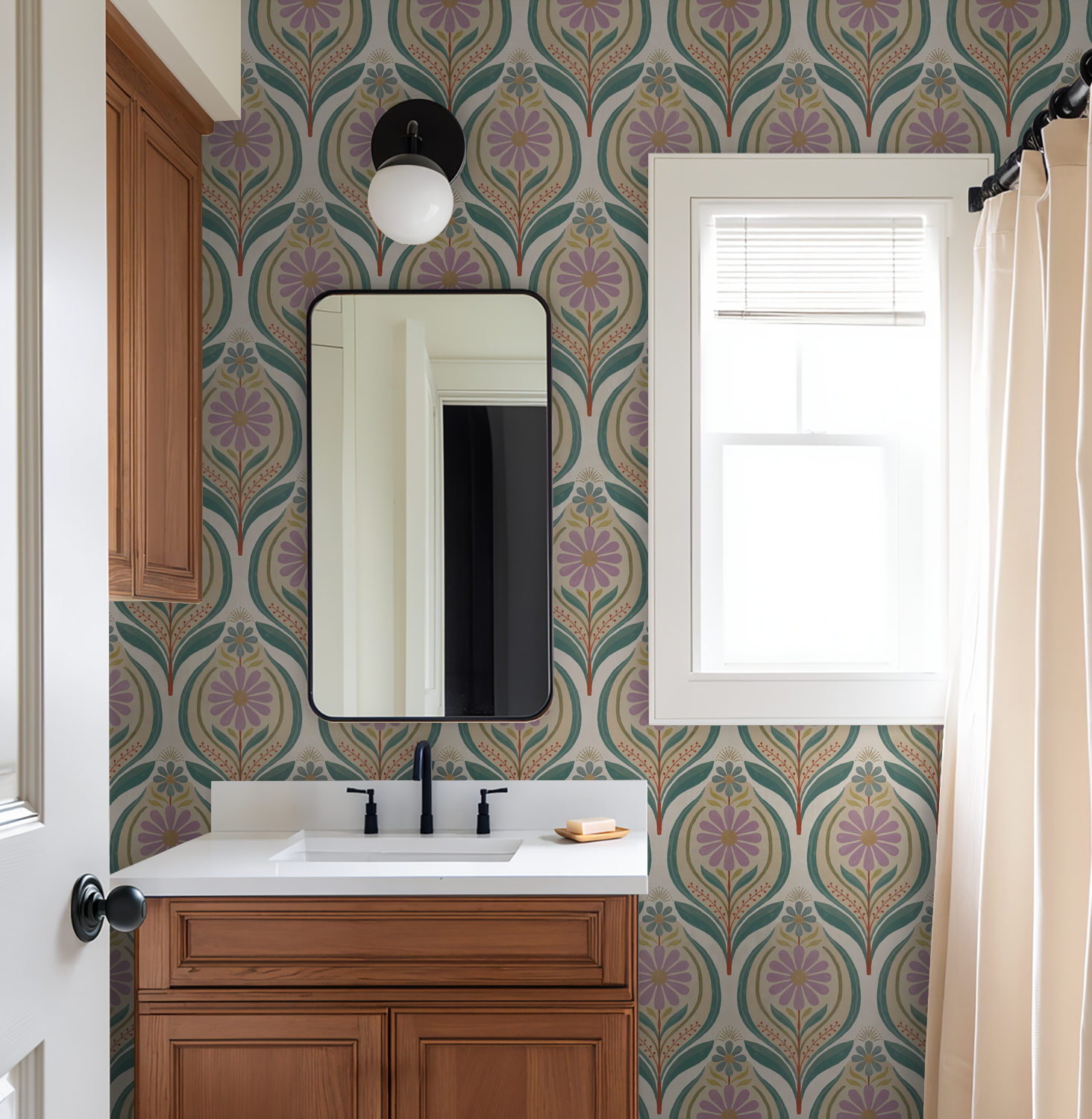 Bathroom with lilac floral and teal leaf wallpaper, wood vanity, and modern mirror.