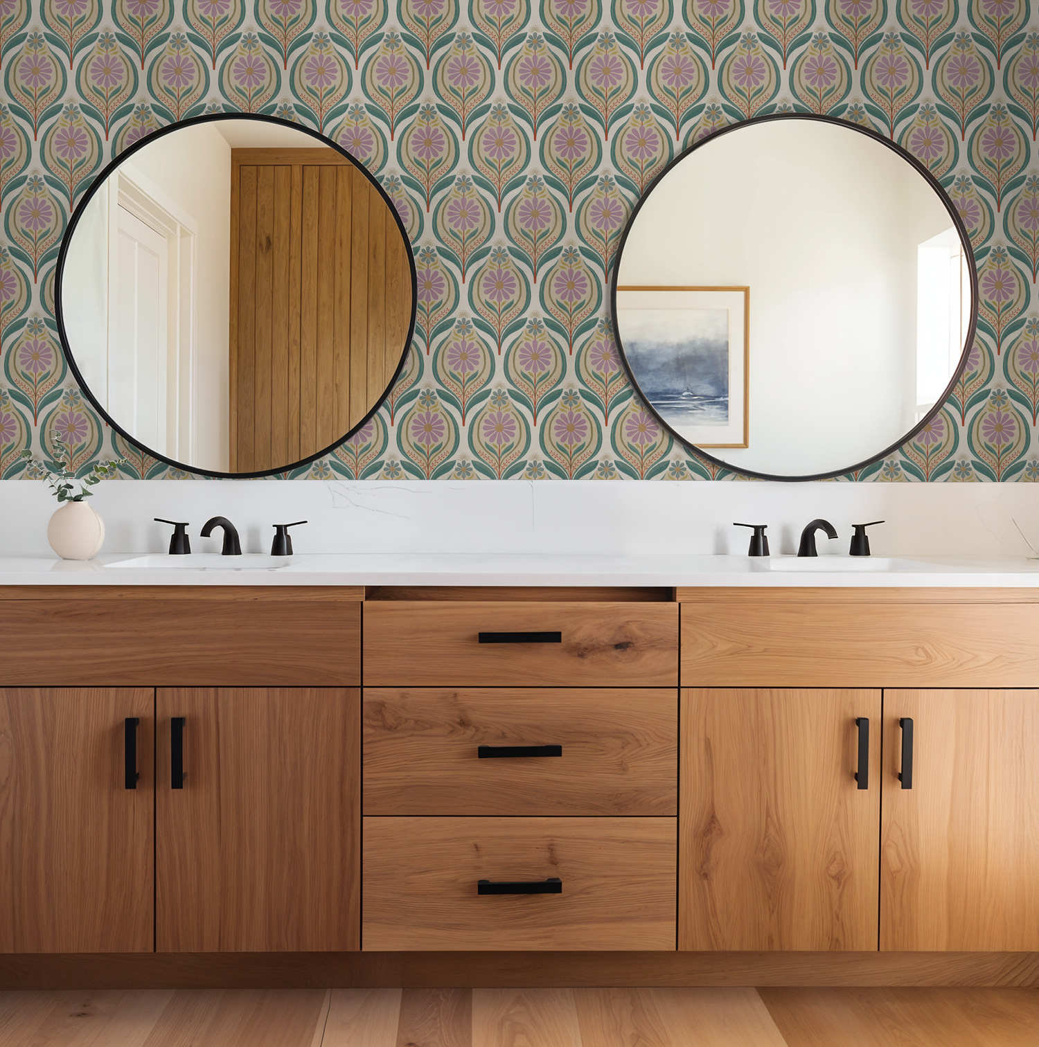 Flora Mae lilac floral wallpaper in bathroom with wood vanity and round mirrors.