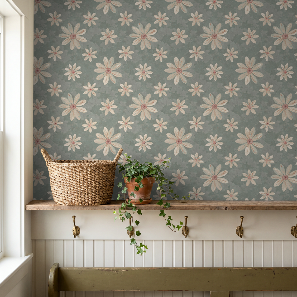 Floral wallpaper with creamy white and dusty pink daisies on sage background in rustic room.