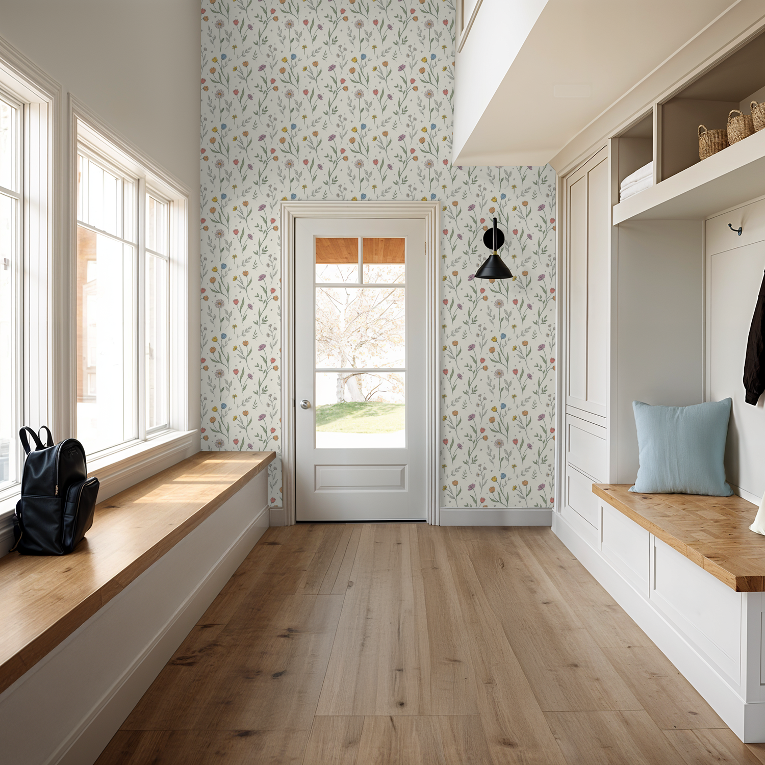 Floral wallpaper with pastel tulips and daisies in a bright entryway with wood accents.