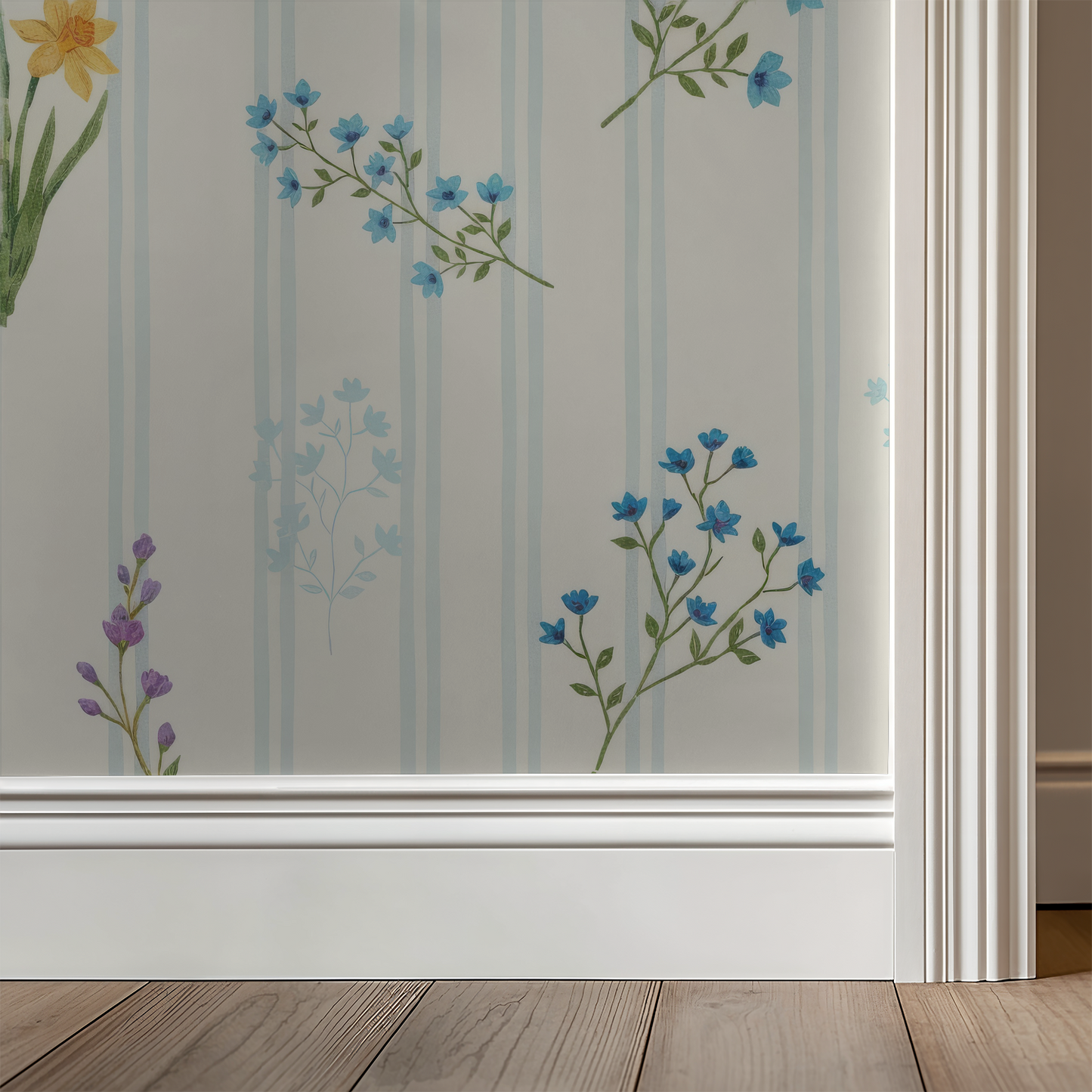 Floral wallpaper with blue and lavender flowers on creamy backdrop in room setting.