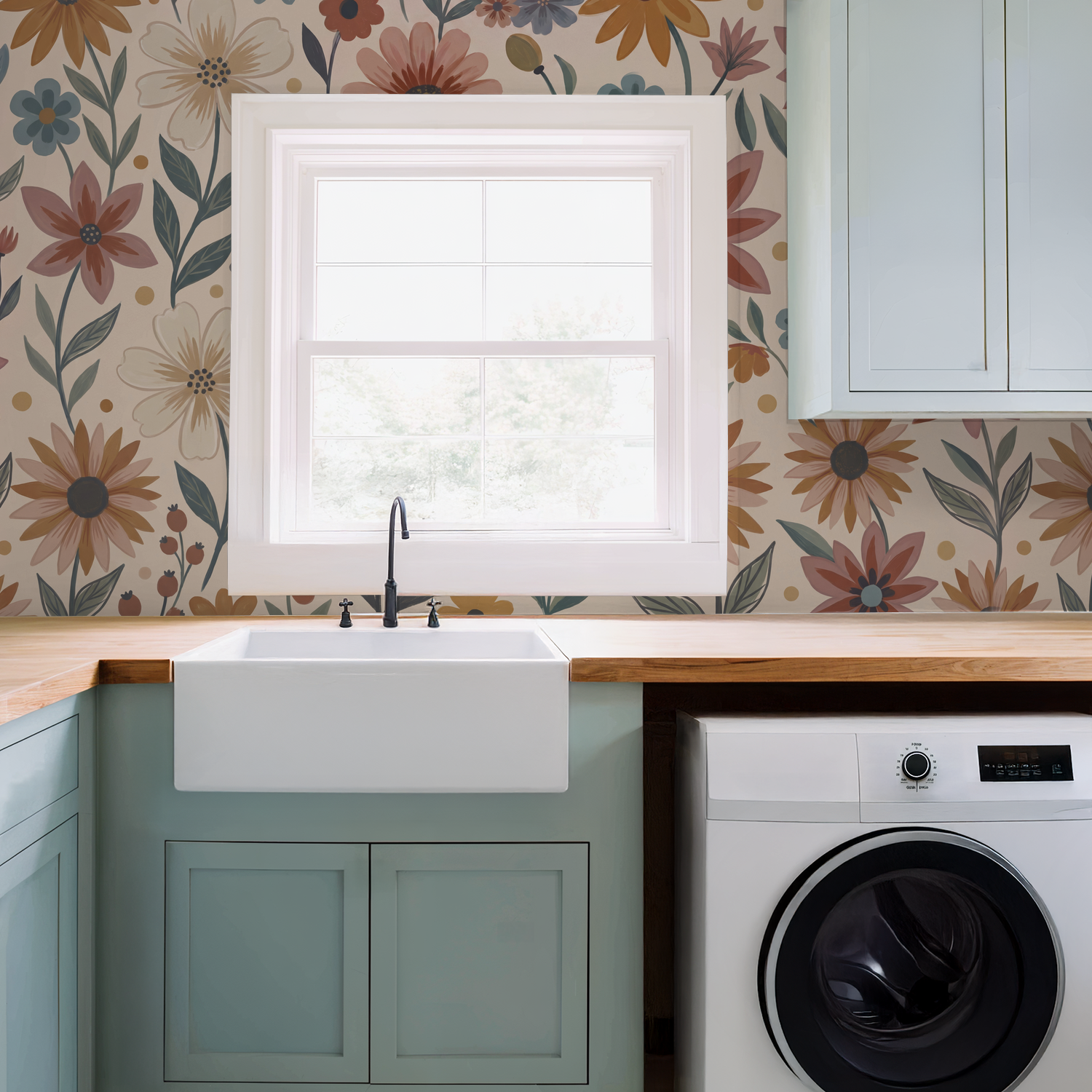 Floral wallpaper in terracotta, mustard, and blue in a laundry room with sink.