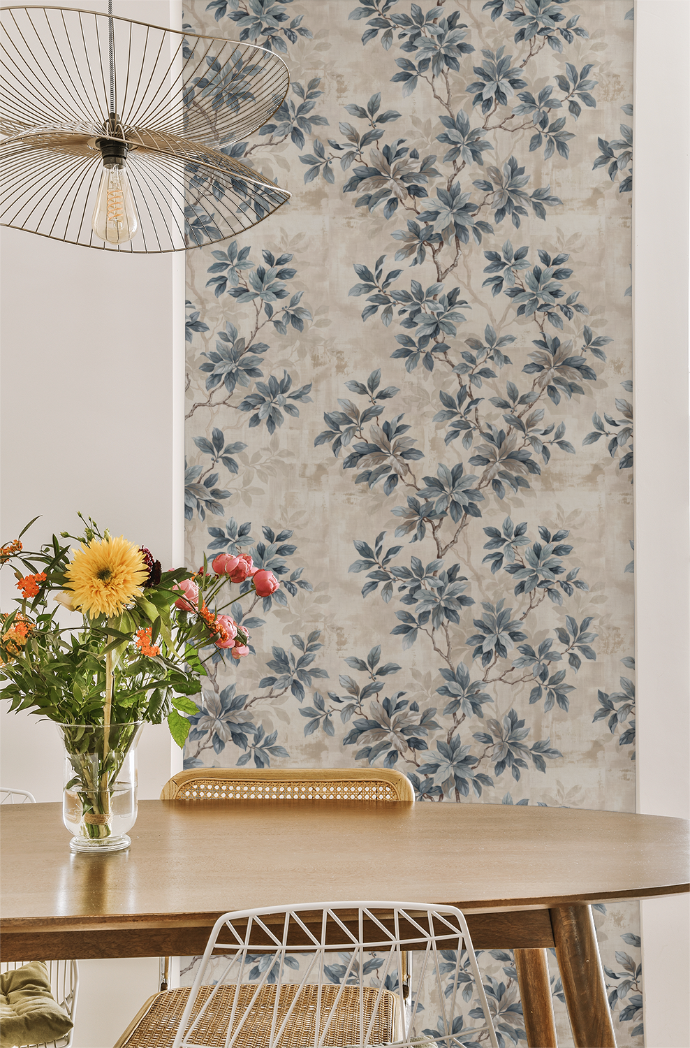 Leafy Daydreams wallpaper with blue floral pattern in dining room setting.