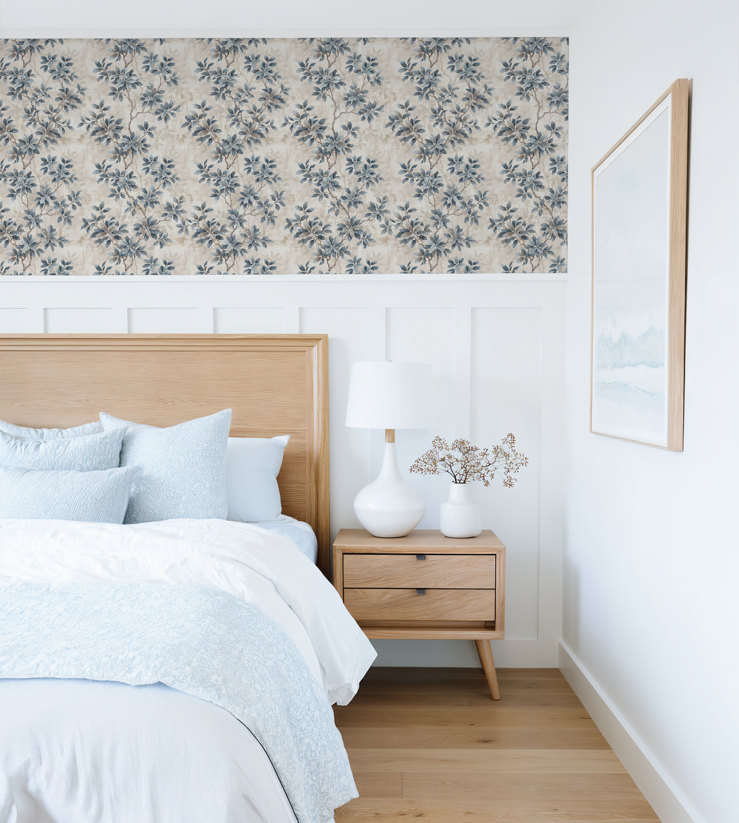 Leafy Daydreams wallpaper with blue-grey foliage in a serene bedroom setting.