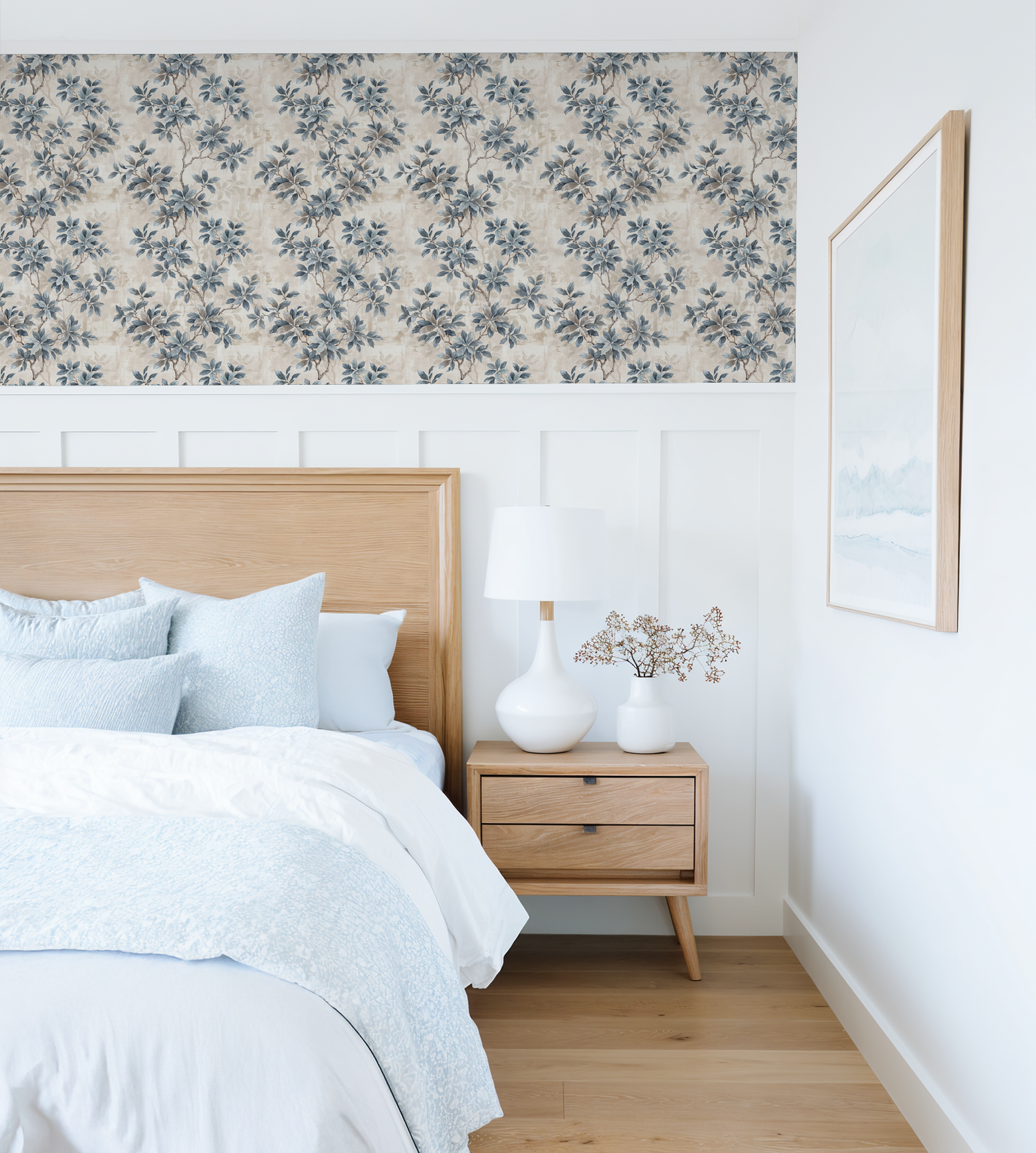 Leafy Daydreams wallpaper with blue-grey foliage in a serene bedroom setting.