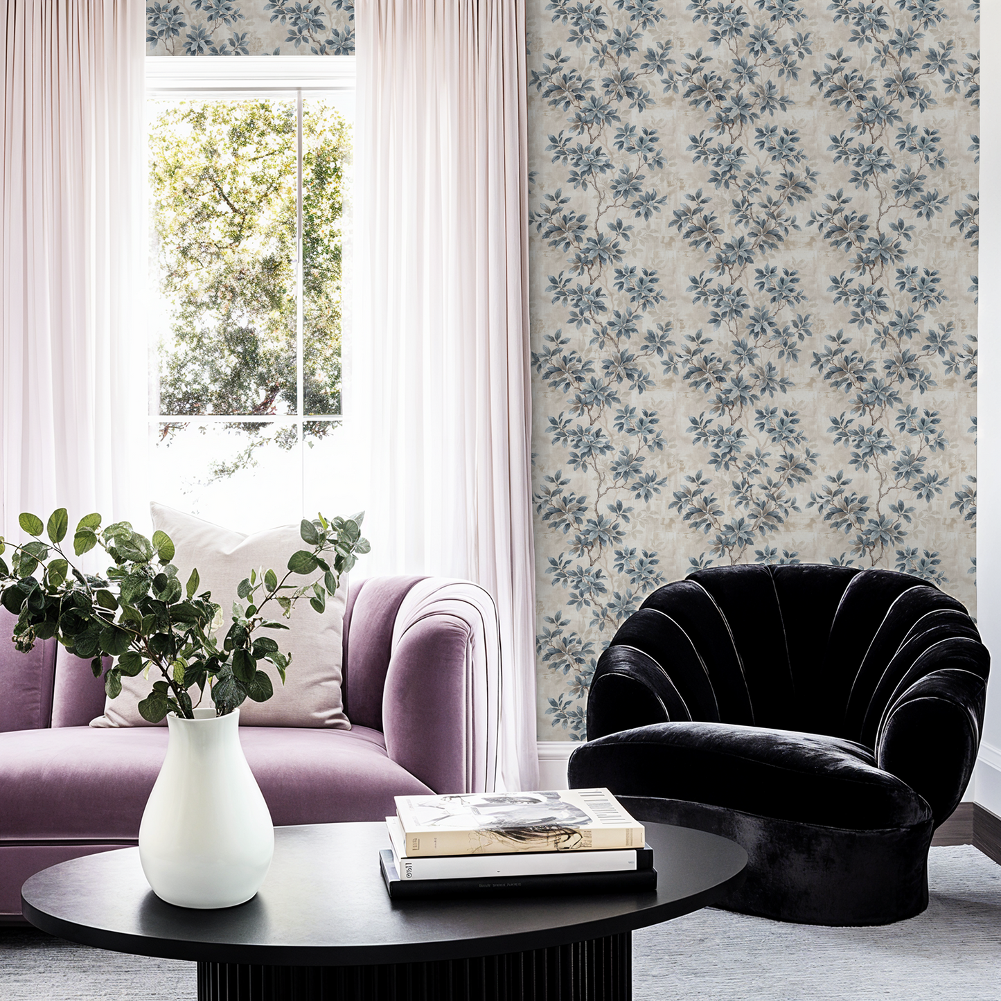 Leafy Daydreams wallpaper with blue and grey foliage in elegant living room setting.