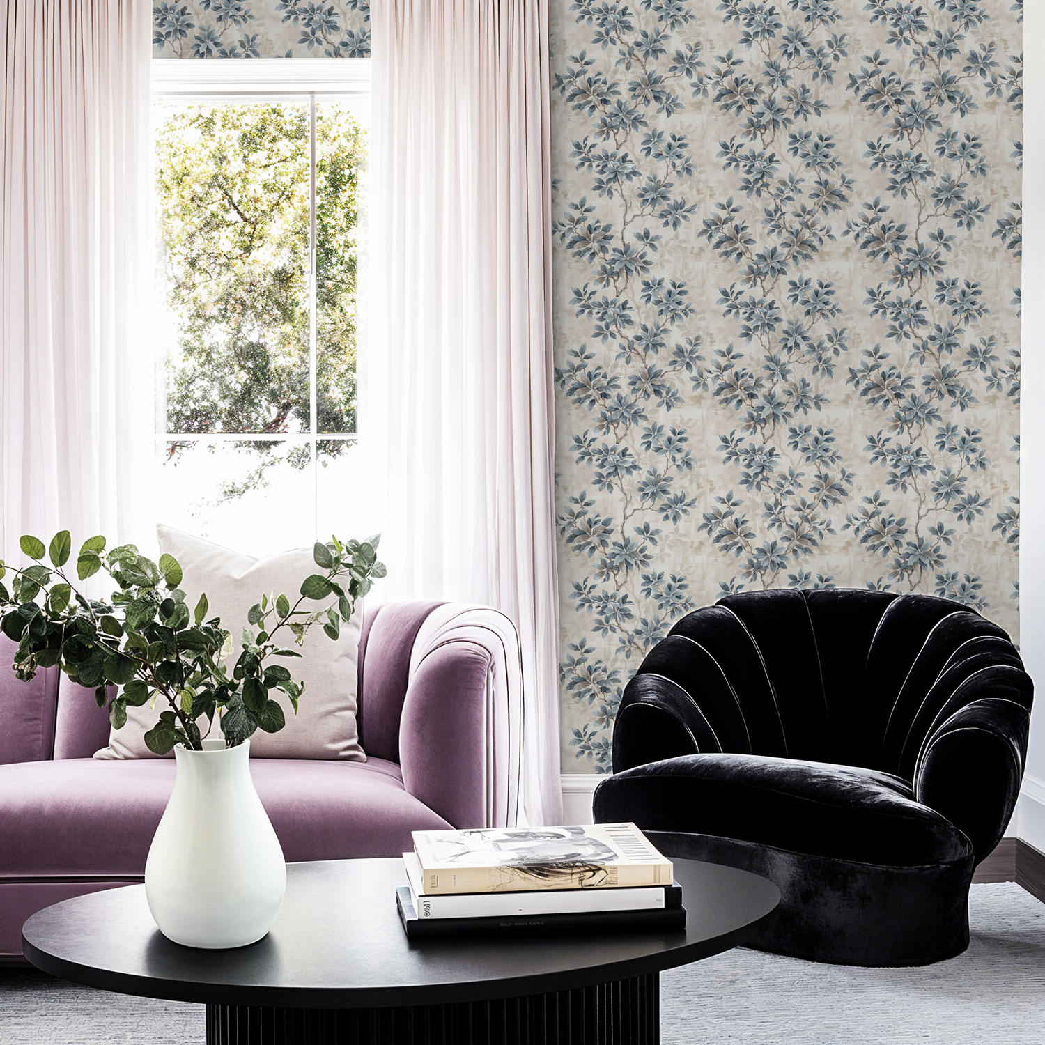 Leafy Daydreams wallpaper with blue and grey foliage in elegant living room setting.