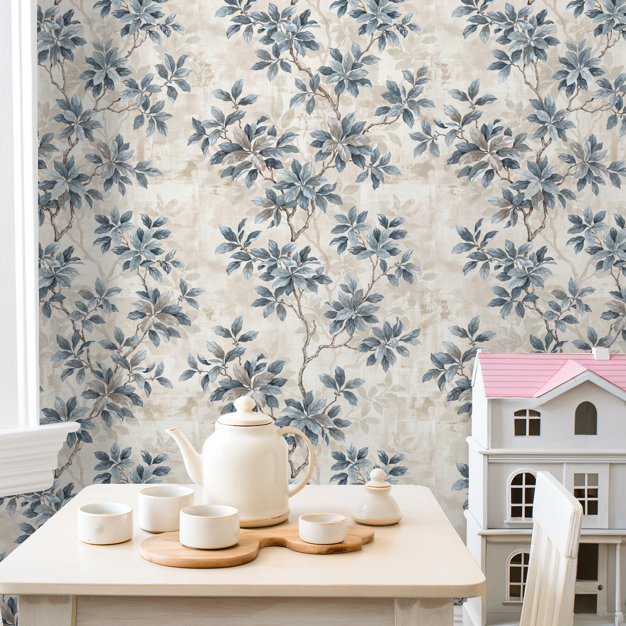 Leafy Daydreams wallpaper with blue-grey foliage in a cozy room setting.