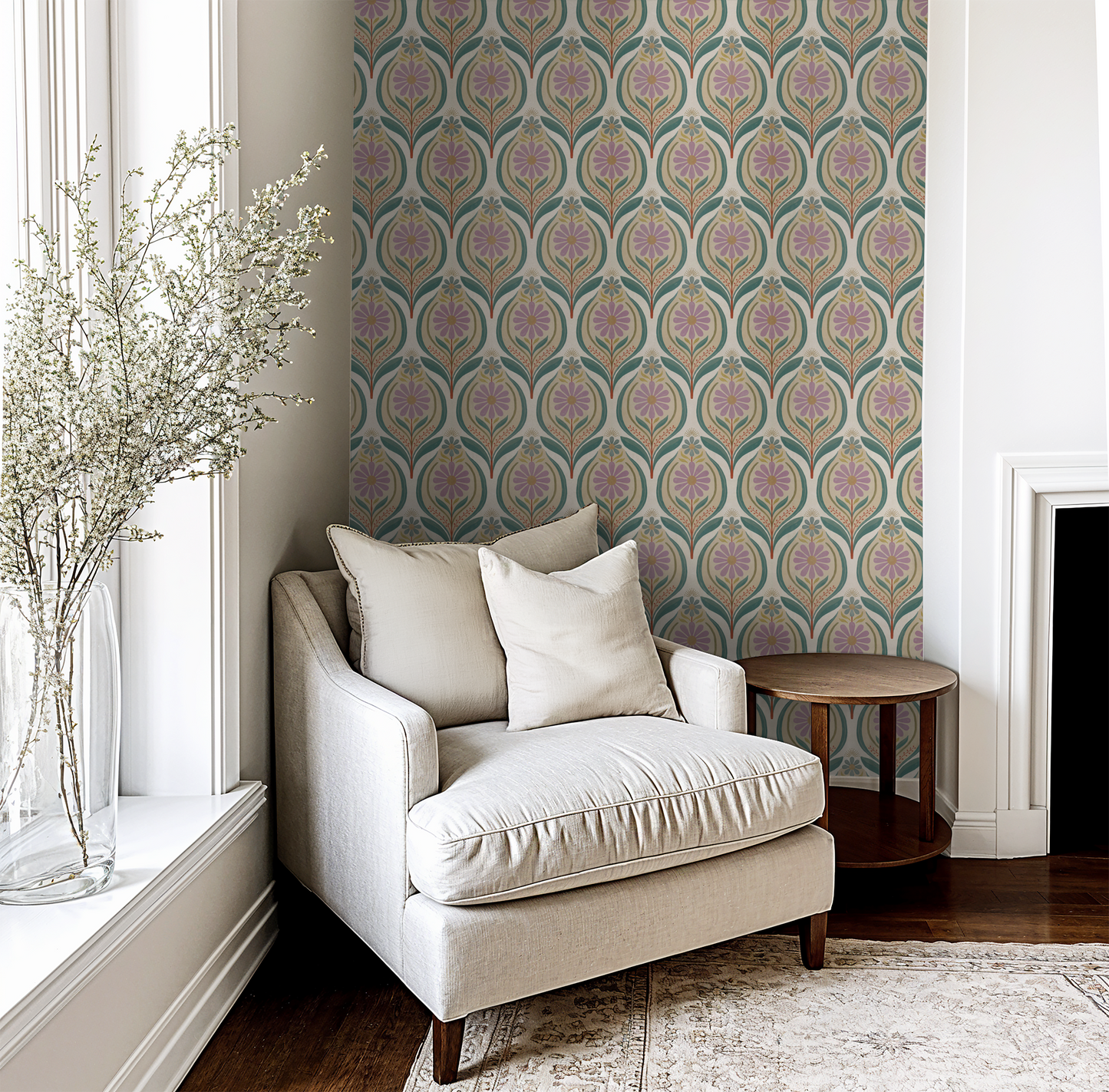 Lilac floral and teal leaf wallpaper in cozy living room with beige armchair.