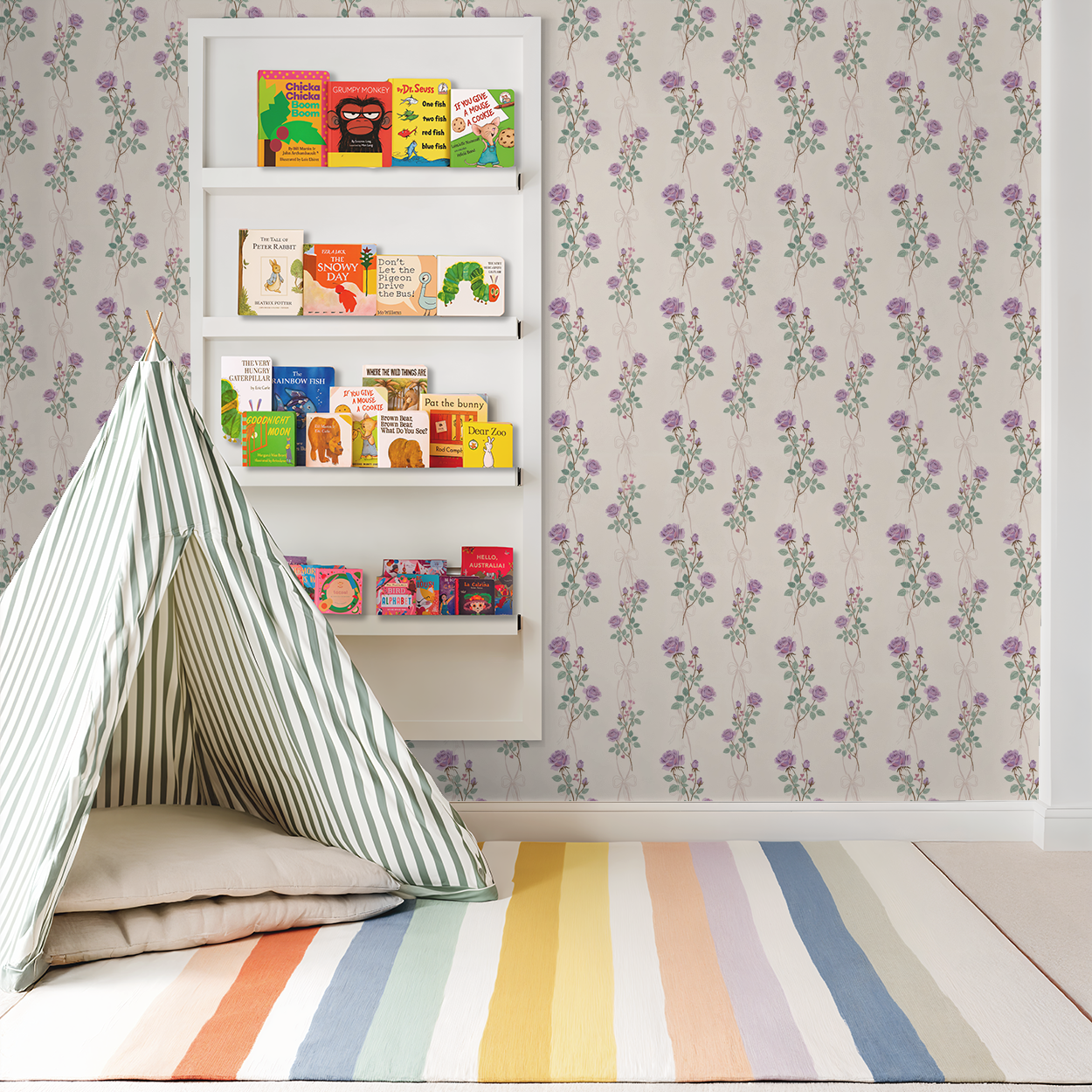 Lilac rose vine wallpaper in nursery with bookshelves and play tent.