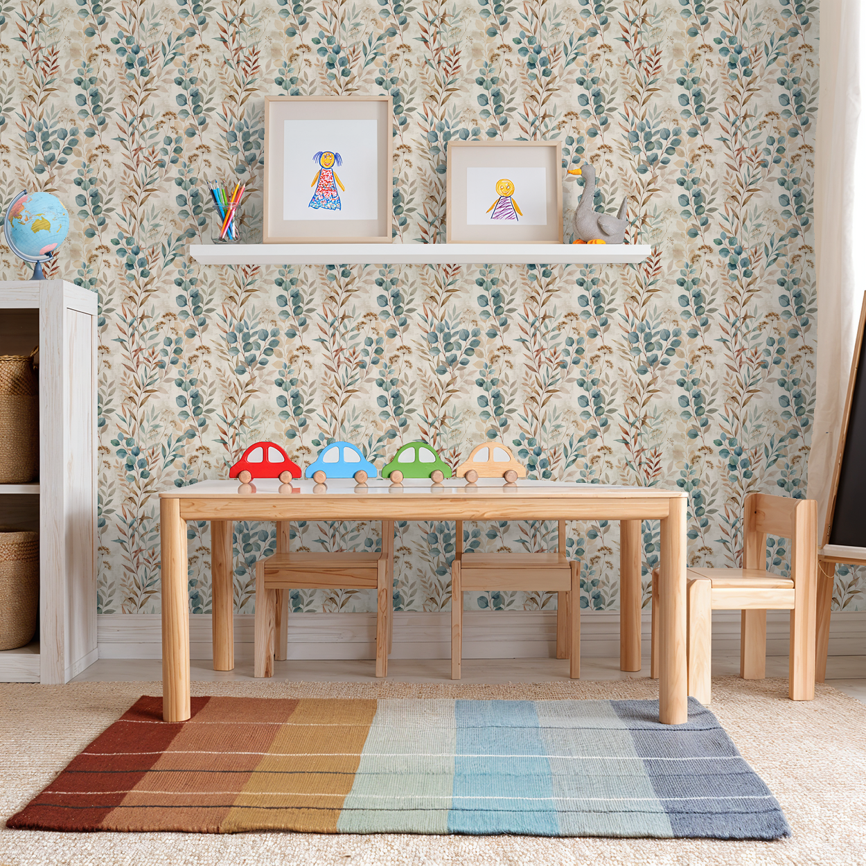 Oleander botanical wallpaper with muted blues and browns in a cozy playroom setting.