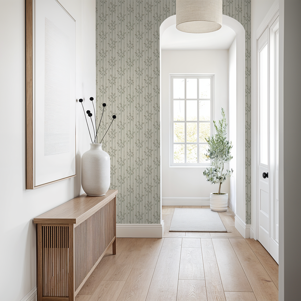 Opulent Blossom wallpaper with vertical stripes and foliage in a bright hallway.