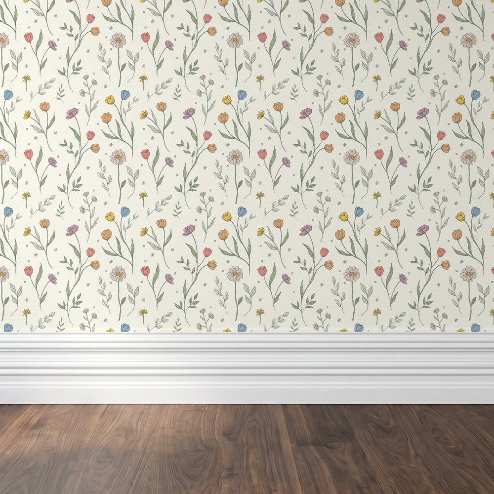 Floral wallpaper with pastel wildflowers on a cream background in a room setting.
