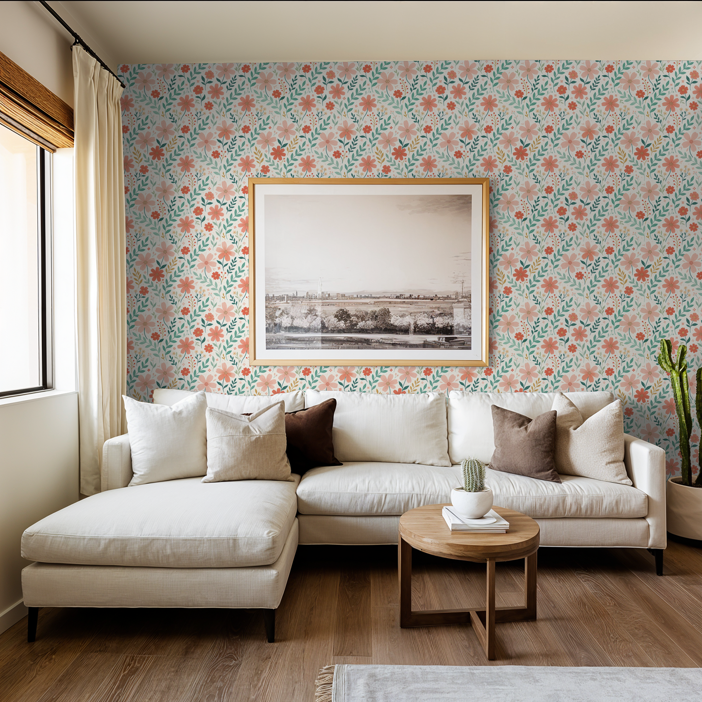 Living room with floral wallpaper in peach and green, white sofa, wooden table.