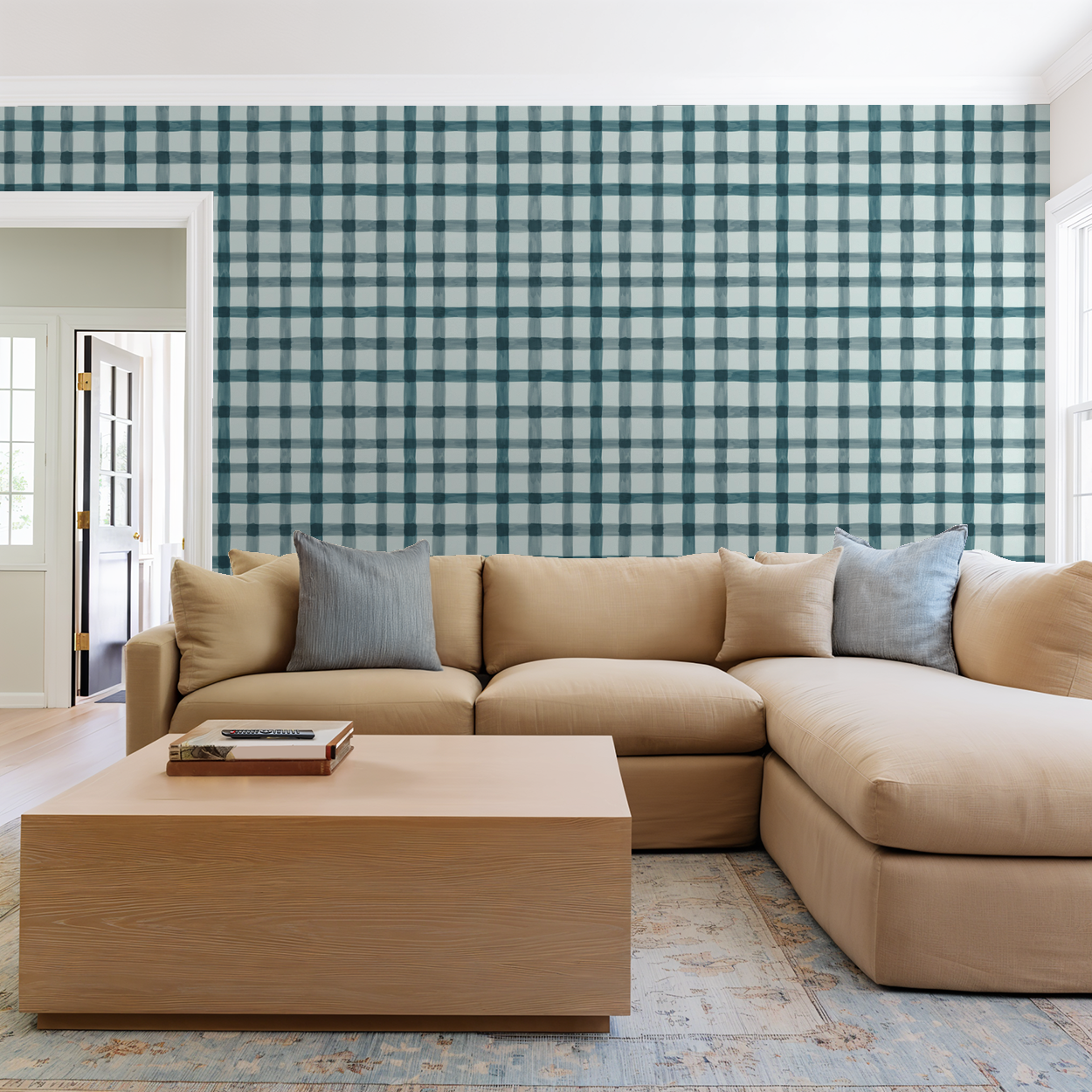 Plaid blue and white wallpaper in a modern living room with beige sofa and wooden coffee table.