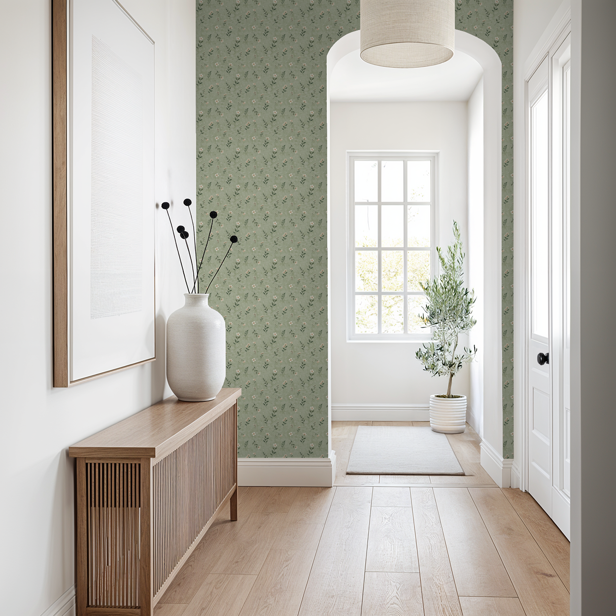 Sage floral wallpaper in a bright hallway with wooden console and plant.