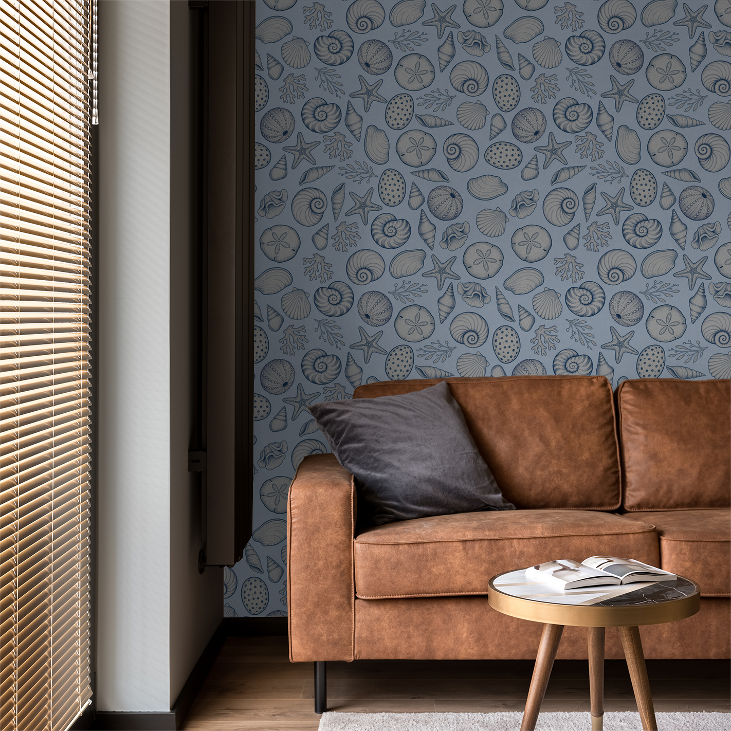 Seashell Cove wallpaper with marine illustrations on blue in cozy living room.
