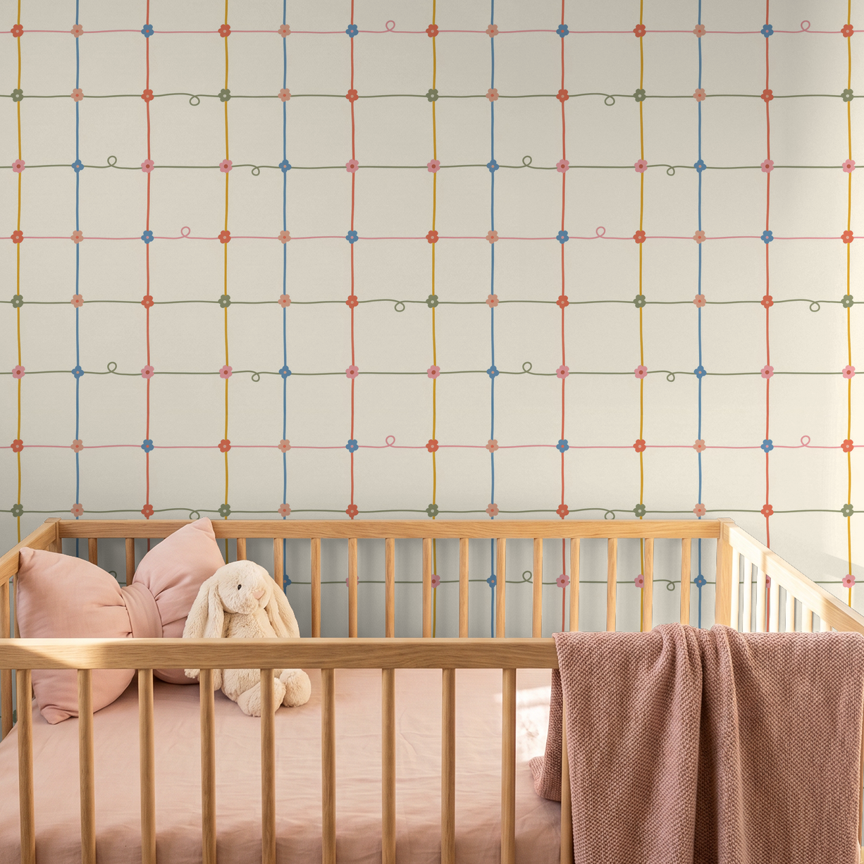 Serene Lace wallpaper with colorful floral grid in nursery with wooden crib
