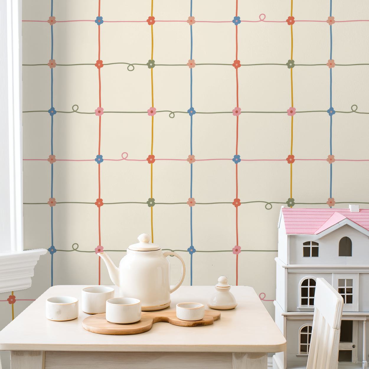 Serene Lace wallpaper with colorful floral grid pattern in cozy room setting with tea set and dollhouse.