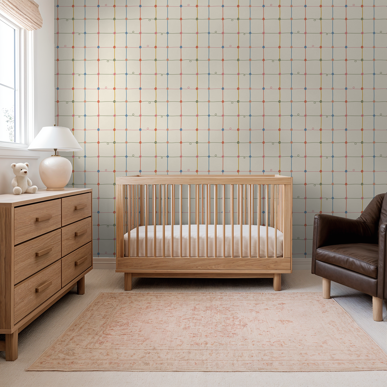 Serene Lace wallpaper with colorful lattice and floral motifs in a cozy nursery setting.