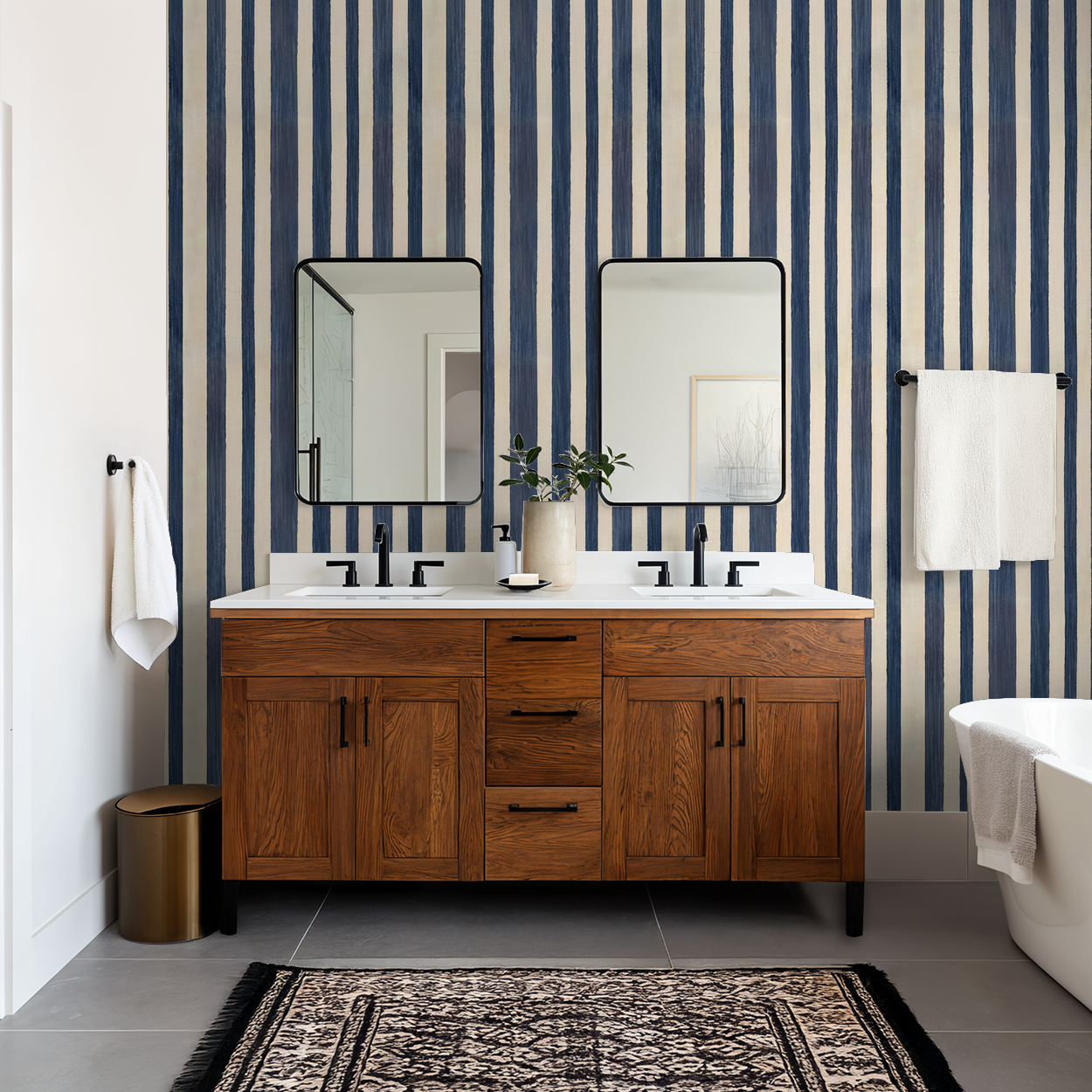 Modern bathroom with blue and beige striped wallpaper, wooden vanity, and dual mirrors.