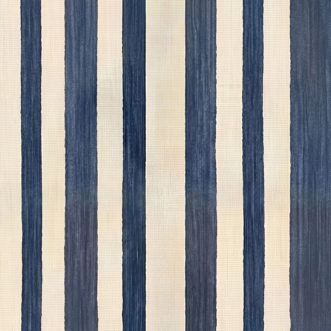 Vertical striped wallpaper with deep blue and beige tones, textured surface.