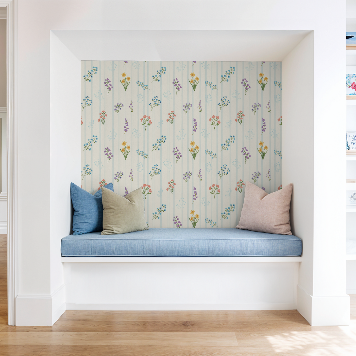 The Juliet floral wallpaper with pastel bouquets on creamy backdrop in cozy nook.