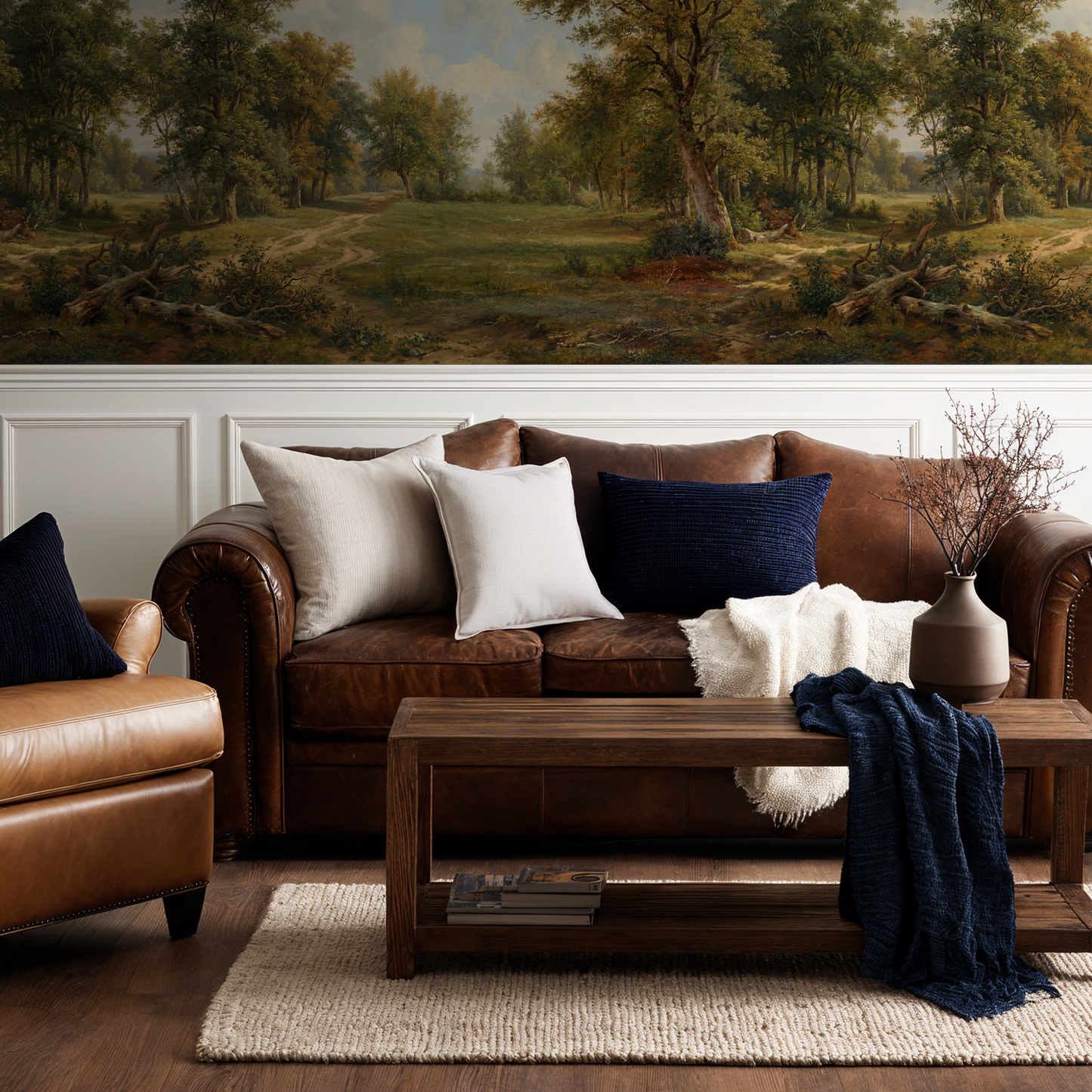 Treehouse Lane wallpaper with pastoral landscape in rustic living room with leather sofa.