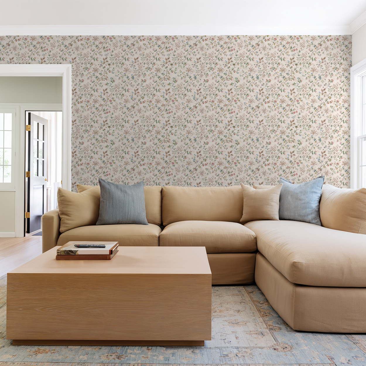 Vintage floral wallpaper with pastel hues in a cozy living room setting.