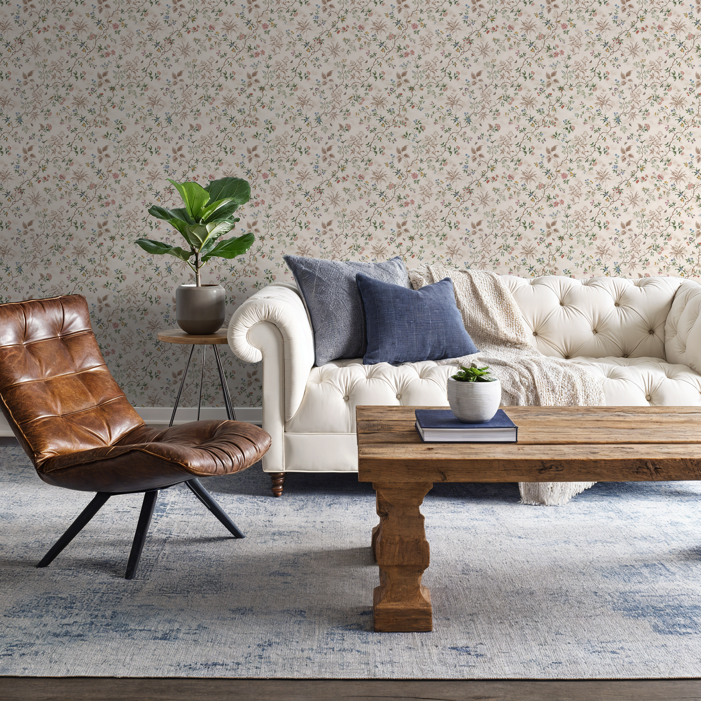 Vintage floral wallpaper with pastel hues in elegant living room setting.