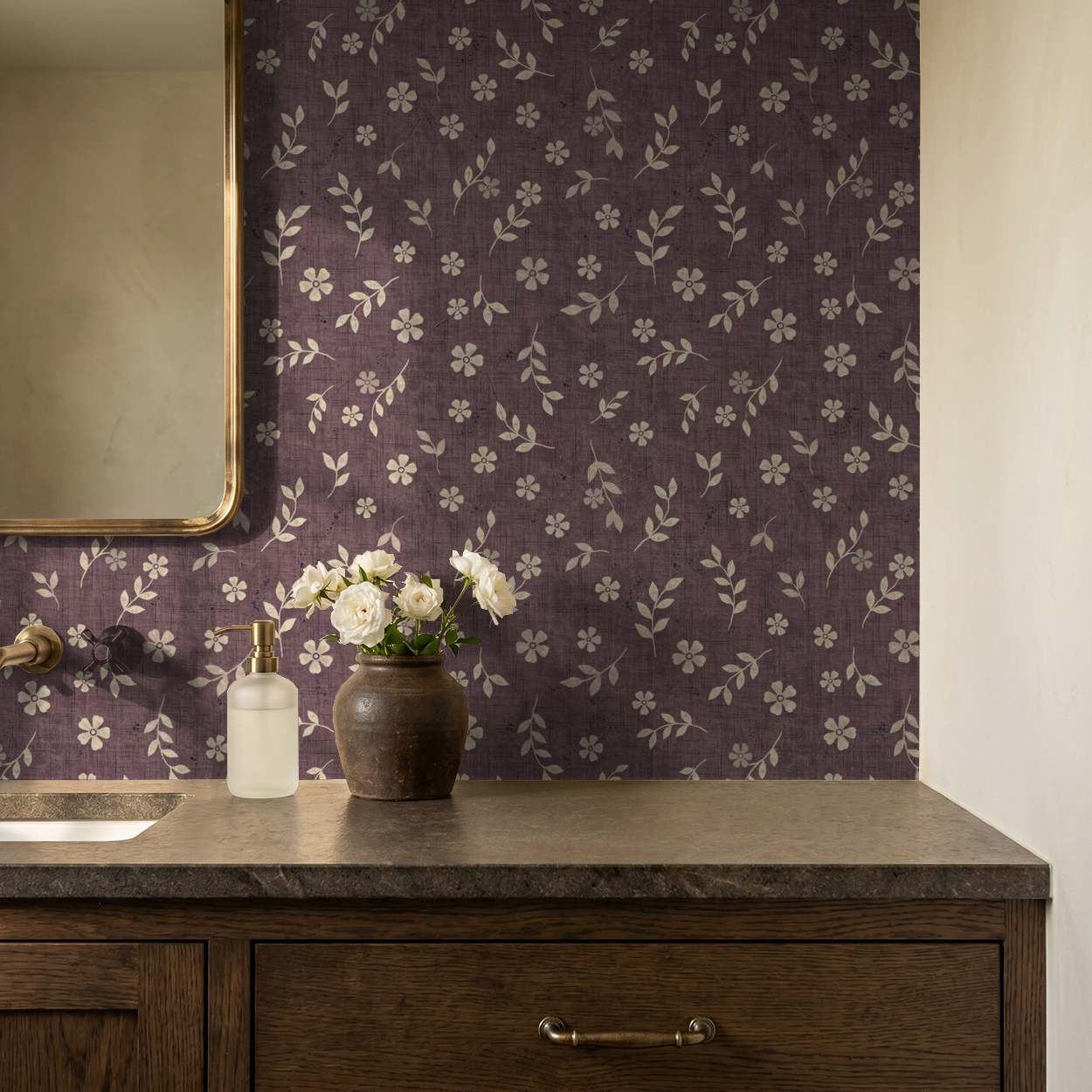Vintage plum floral wallpaper in bathroom with wooden vanity and flowers.